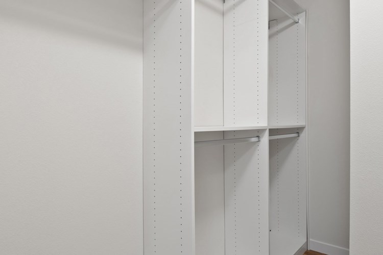 New custom closets with ample hanging and shelf space. 