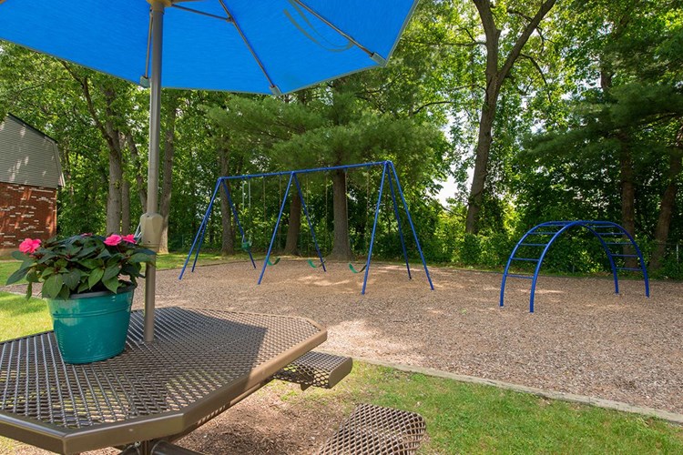 Sit under our shaded picnic tables or enjoy our on-site playground.