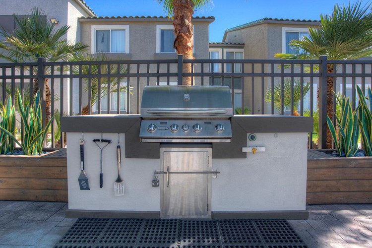 Our outdoor kitchen features a gas grill so you can have a cookout by the pool.