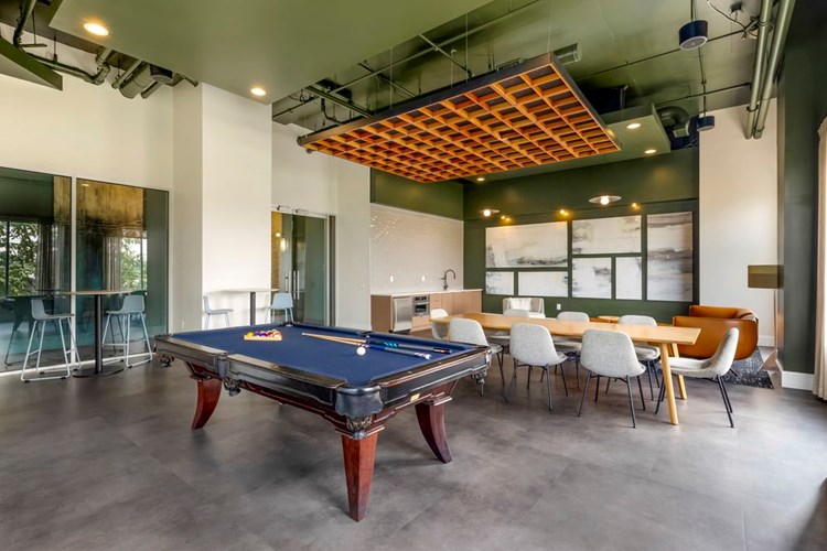 Resident lounge with pool table and coworking spaces