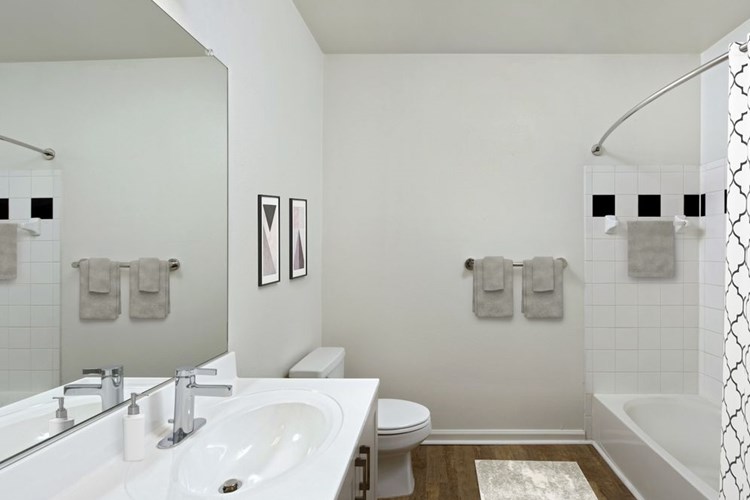 Renovated II bathroom with white cultured marble countertop and hard surface flooring