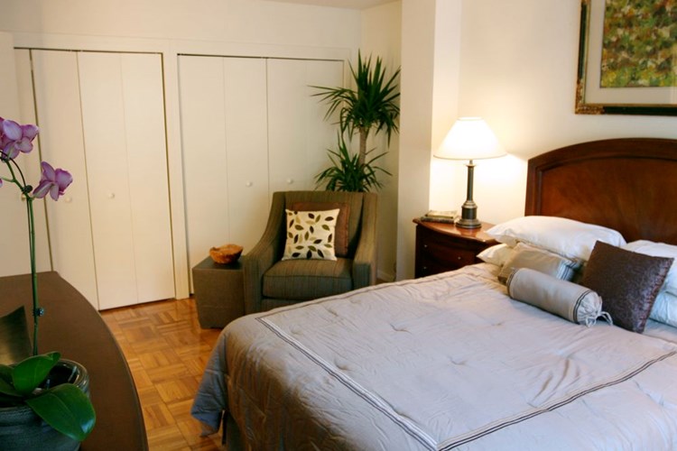 Bedroom with parquet flooring