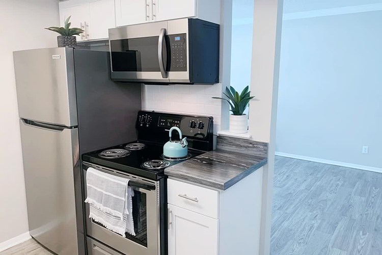 Our studio apartment homes features a separate kitchen area.