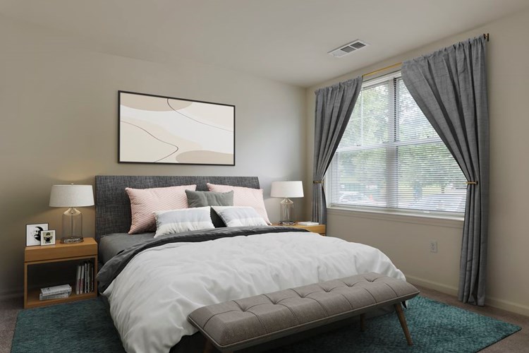 Bedroom with hard surface flooring (in select homes)