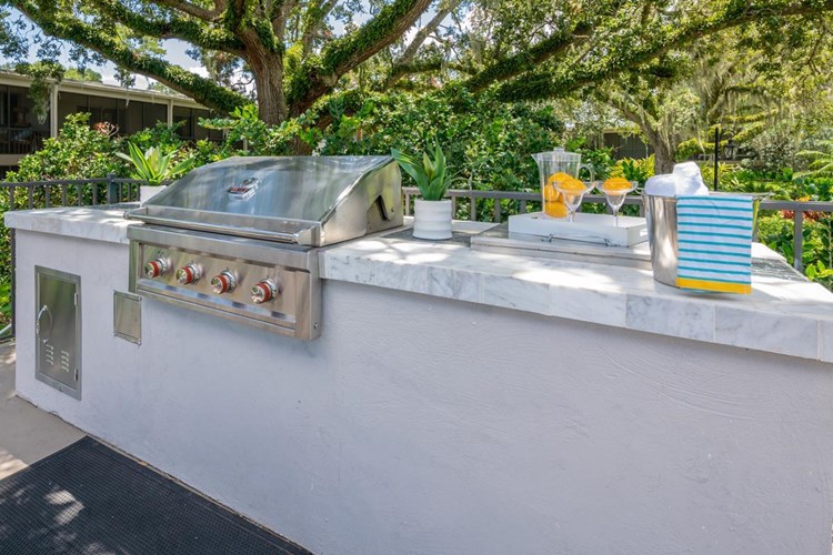 Have a cookout at our outdoor kitchen featuring a gas grill.