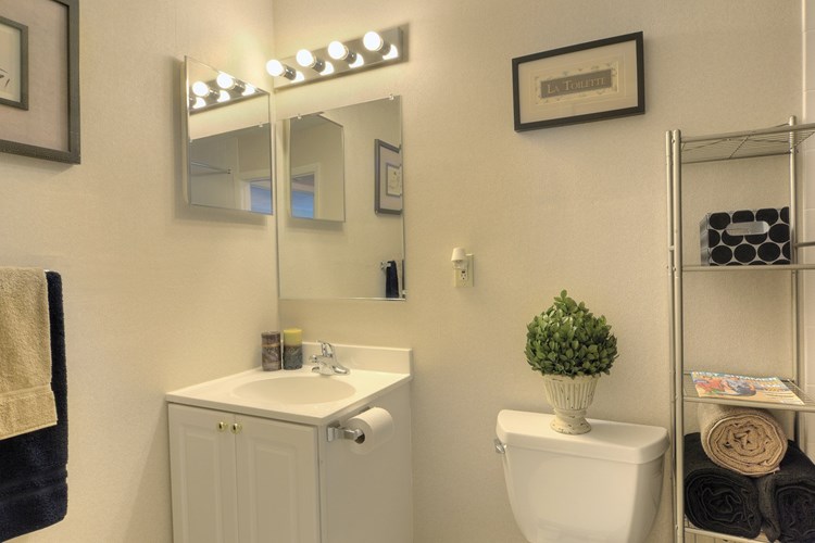 Well-lit bathroom with neutral colors