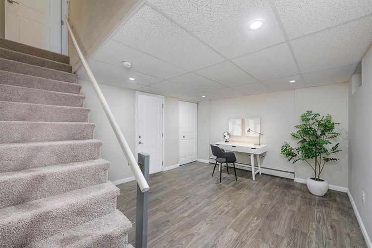 Select floor plans offer a finished basement with wood-style flooring.