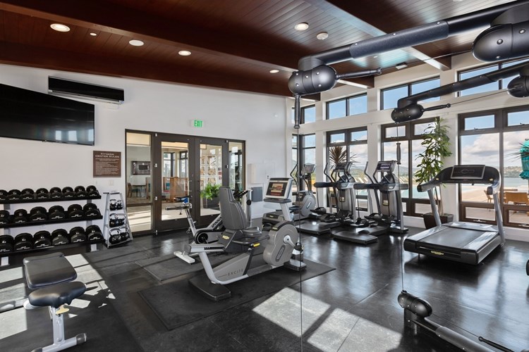 Stay fit at our high-tech fitness center featuring treadmills, elliptical machines, bikes, a cable weight system and free weights