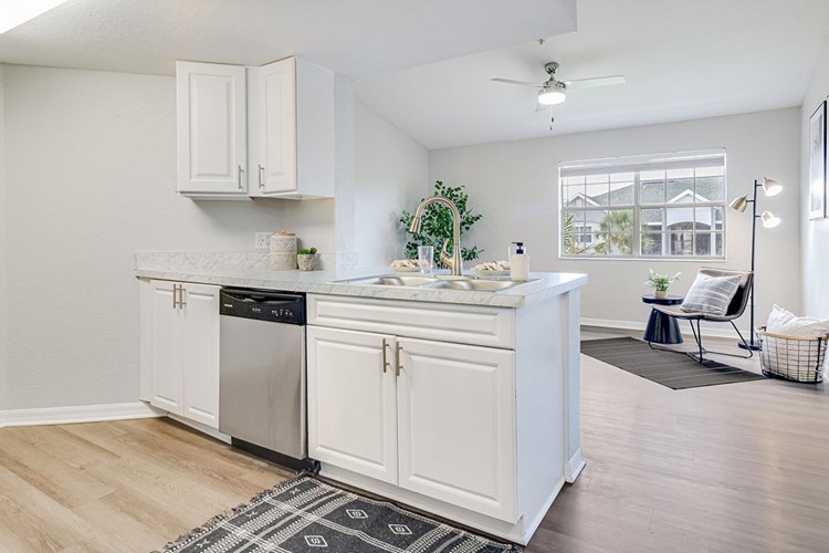 Kitchens feature a breakfast bar overlooking the living area.