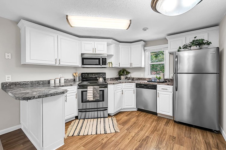 Updated kitchens with stainless steel appliances.