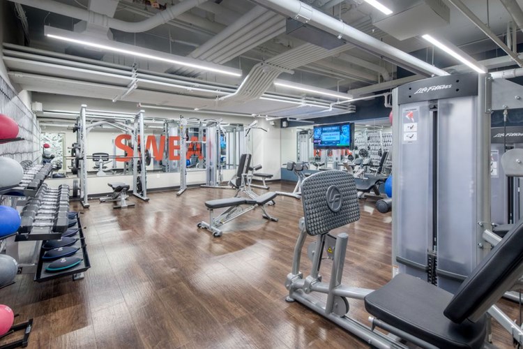 Fitness center with strength equipment and flat screen television