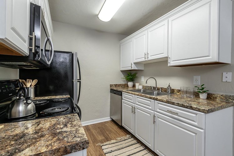 Our floor plans feature galley-style kitchens and ample cabinetry. 