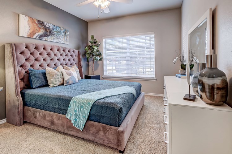 Stunning Master Bedroom with plush carpet and ceiling fans