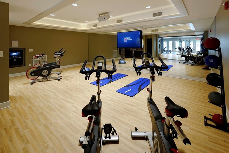 Fitness center with spin bikes and Fitness on Demand programming