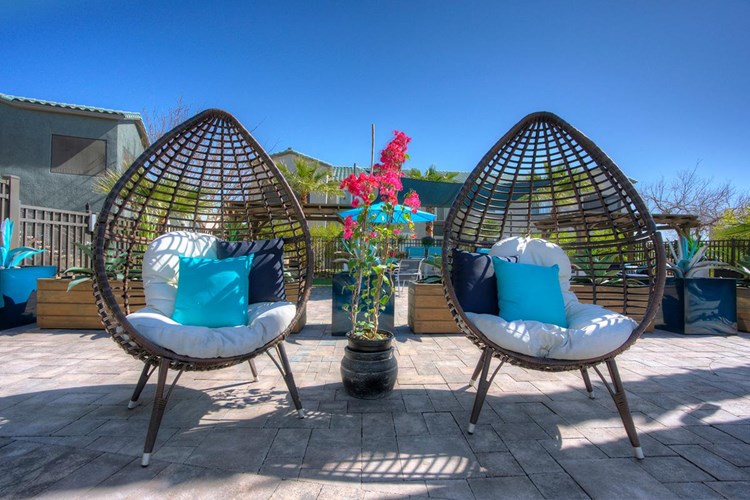 Relax in comfortable seating while enjoying the beautiful views of the pool.