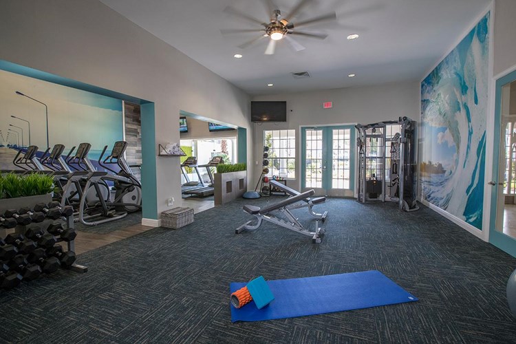 Our fitness center also features an open area, perfect for yoga or mat exercises. 