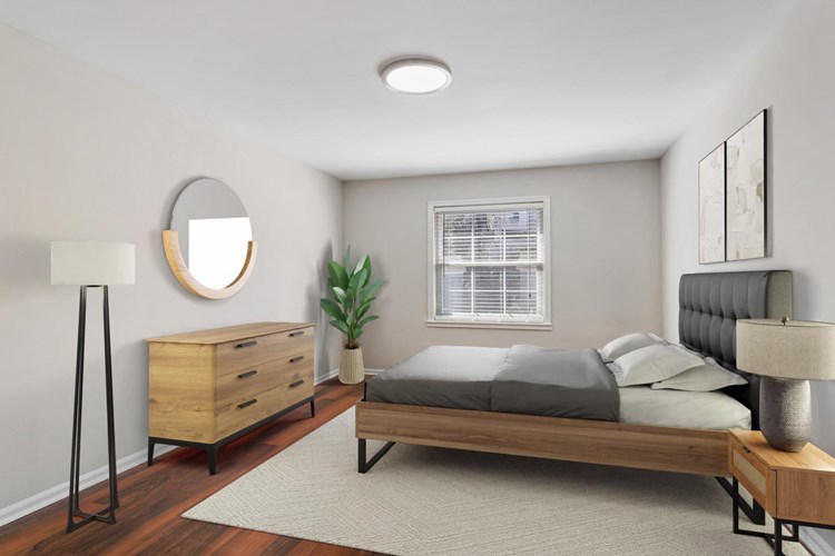 Spacious bedrooms with wood flooring throughout
