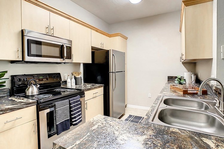 Premium kitchens feature tiled flooring, ample cabinet space, and stainless-steel appliances.