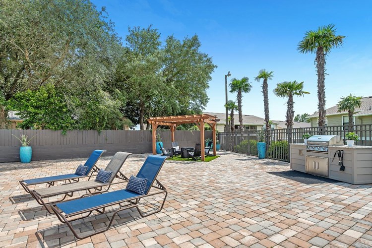 Have a cookout by the pool at our outdoor kitchen featuring a gas grill.