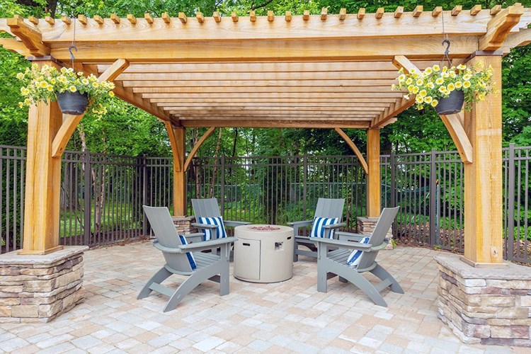 Warm up by our poolside firepit under our pergola.