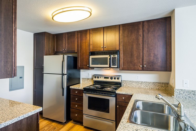 Kitchens feature granite countertops and offer a separate dining area to enjoy your meals