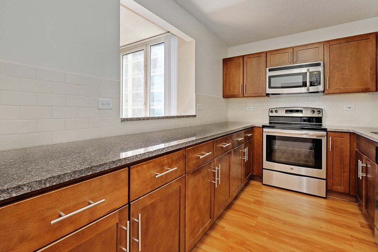 Enjoy a newly-renovated kitchen with granite countertops and stainless steel appliances