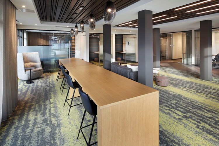 Phase II Hive Co-Work Lounge with separate seating areas and private office spaces, perfect for working remote