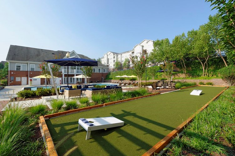 Courtyard with swimming pool, sundeck, lounge seating and outdoor gaming area