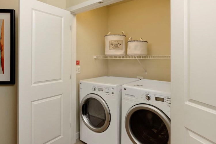 In-unit washer and dryer with storage space