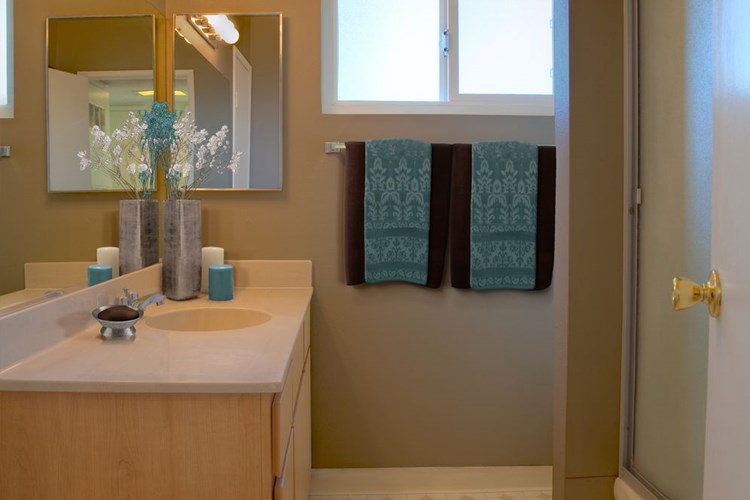 Classic Package I bath with oak cabinetry, white laminate countertops, and hard surface flooring
