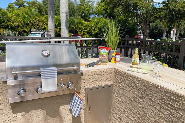Have a cookout at our outdoor kitchen featuring a gas grill.