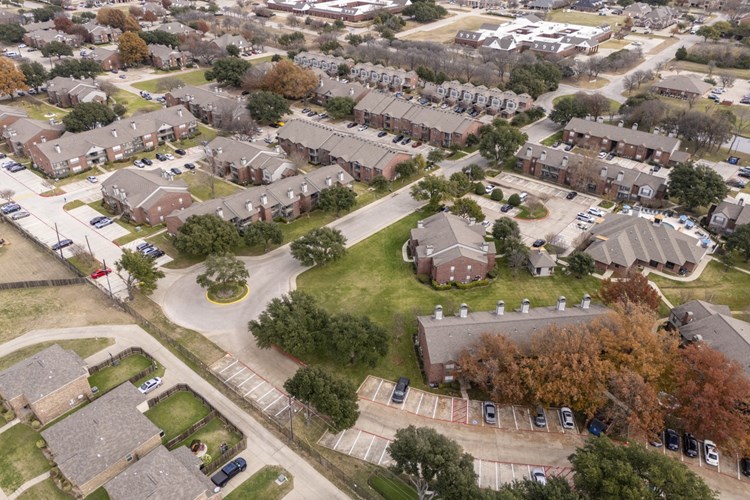 An aerial view of a neighborhood of houses in a suburb