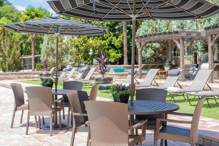 Our expansive sundeck features plenty of tables with umbrellas.