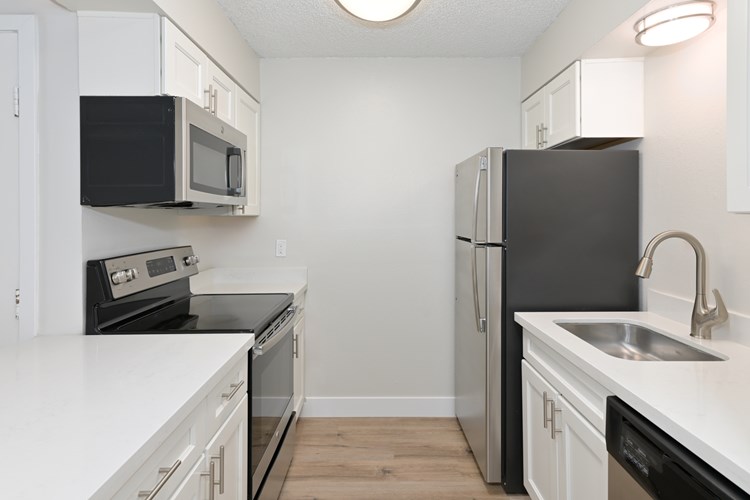 Kitchens features stainless steel appliances and updated cabinetry