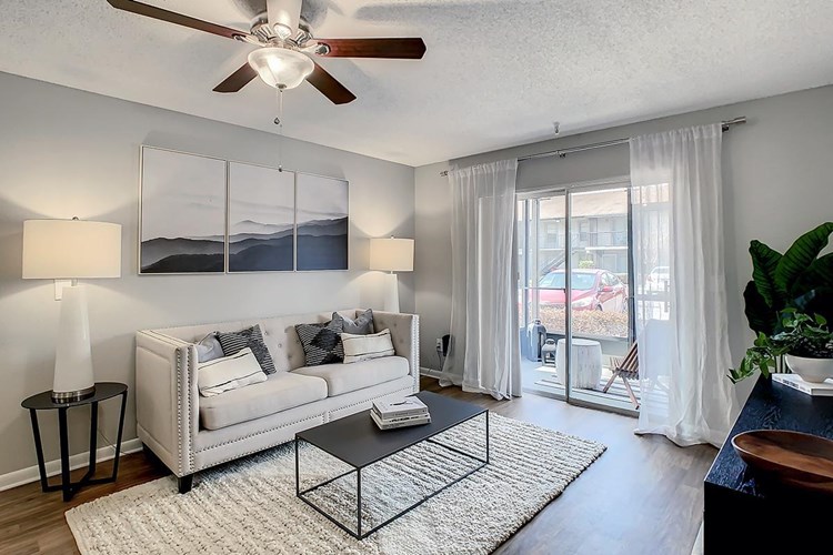 Perfectly spacious and modern living room with a contemporary ceiling fan you will enjoy.