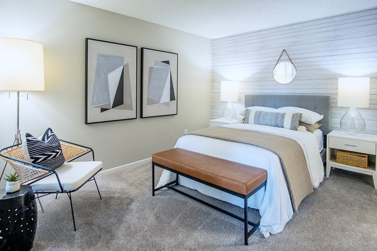 Spacious bedrooms large enough to accommodate a king-size bed, with large windows and walk-in closets.