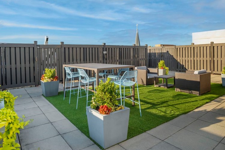 Rooftop terrace with dining areas and lounge seating