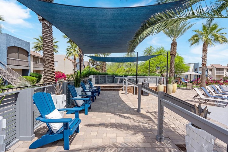 Relax in the shade under our poolside sunsails.