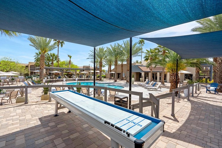 Enjoy a game of shuffleboard by the pool.