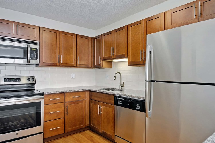 Kitchens feature stainless steel appliances and great cabinet space