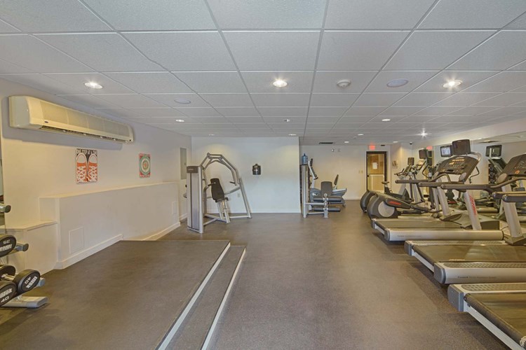 24-hour fitness center includes cardio and weight training equipment