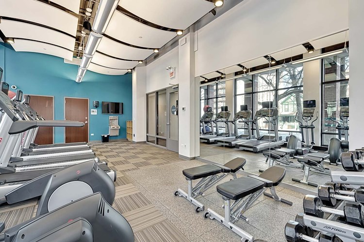 Fitness center features LifeFitness cardio machines, personal TVs and weight equipment