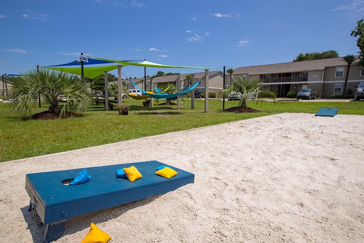 Play a game of corn hole at our sanded game area located next to the hammock garden.