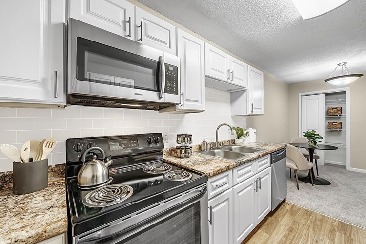 Newly renovated kitchens featuring stainless steel appliances.