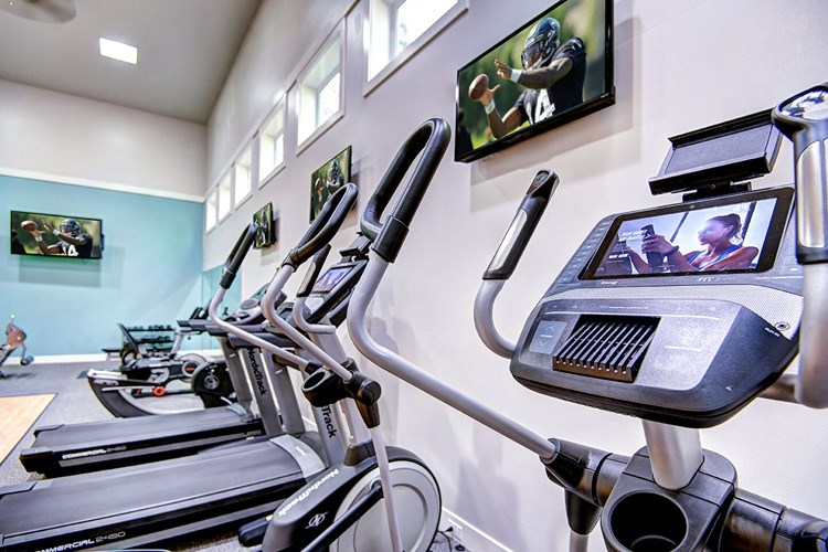The Reserve at Bucklin Hill gym with treadmill and TV