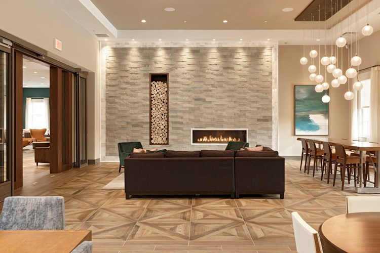 Resident lounge with fireplace and seating