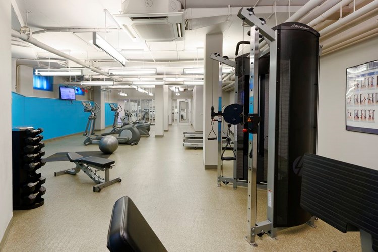 Fitness center with strength equipment and flat screen televisions