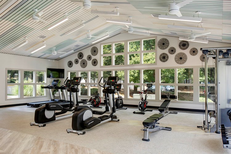 Brand-new fitness center boasts an expansive workout space with a variety of new equipment