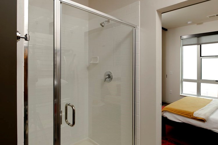 Bath with walk-in shower and hard surface flooring