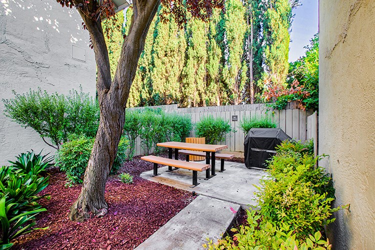 Picnic area with barbeque at Pleasanton Place Apartment Homes